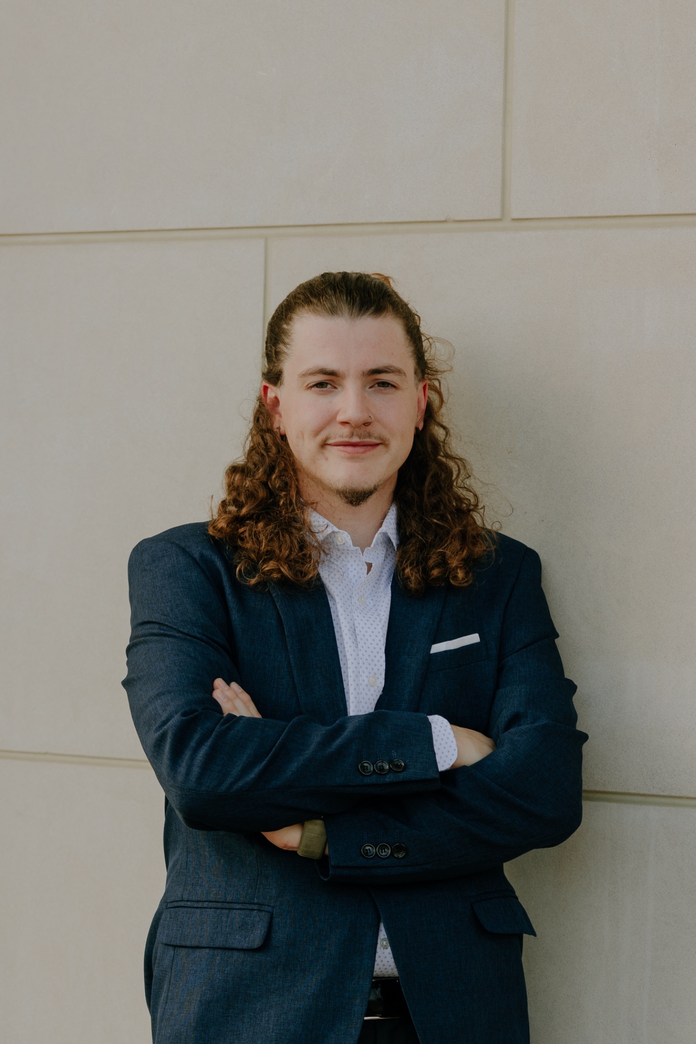 Coleman Williams wearing a navy suit